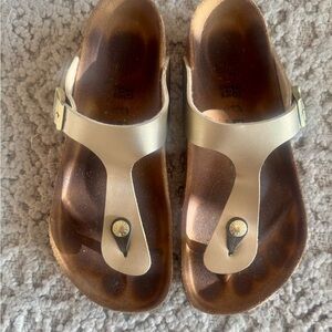 Gold Birkenstock Gizeh sandals